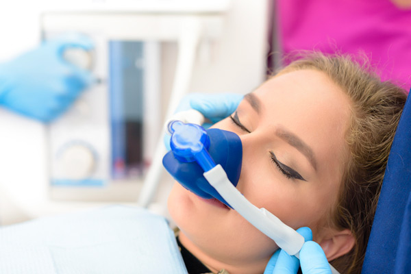 Sedated woman in dental chair at Peak Endodontics in Covington, WA